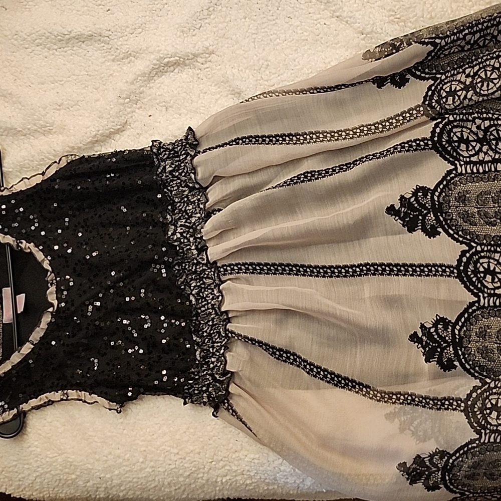 Fancy dress in black and light grey, not sold if you see it , still available